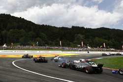 Kevin Magnussen, Haas F1 Team VF-17, chases Lance Stroll, Williams FW40, Felipe Massa, Williams FW40