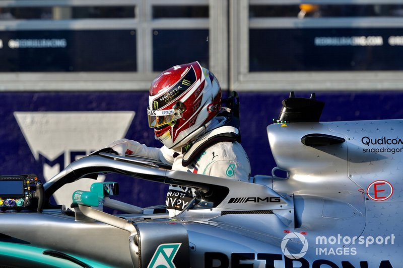 Lewis Hamilton, Mercedes AMG F1, climbs out of his car after securing pole position