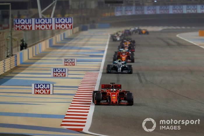 Sebastian Vettel, Ferrari SF90, leads Valtteri Bottas, Mercedes AMG W10, and Charles Leclerc, Ferrari SF90