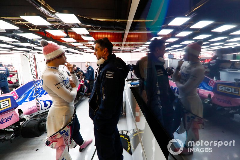 Lance Stroll, Racing Point, talks to Andy Stevenson, Sporting Director, Racing Point, in the team's garage