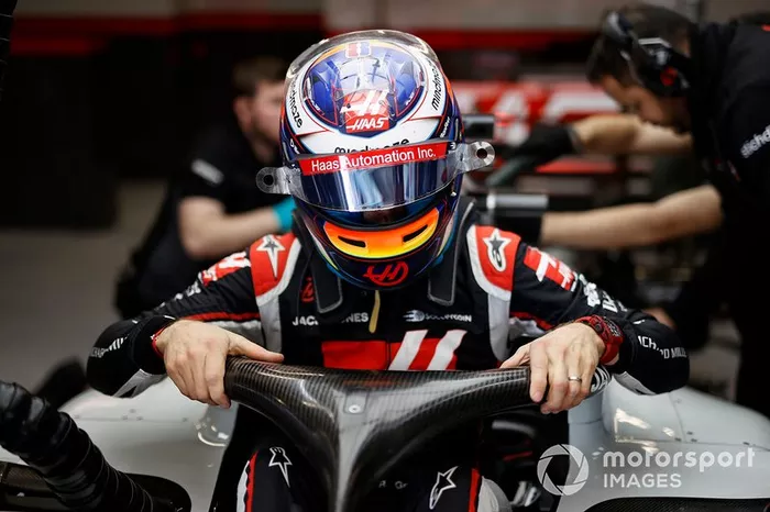 Romain Grosjean climbs into his Haas VF-20 