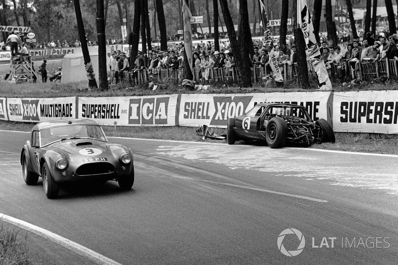 eter Bolton, Ninian Sanderson, AC Cobra 289 Ford Coupe, passes the wreckage of Richard Attwood, David Hobbs, Lola GT Mk 6 Ford