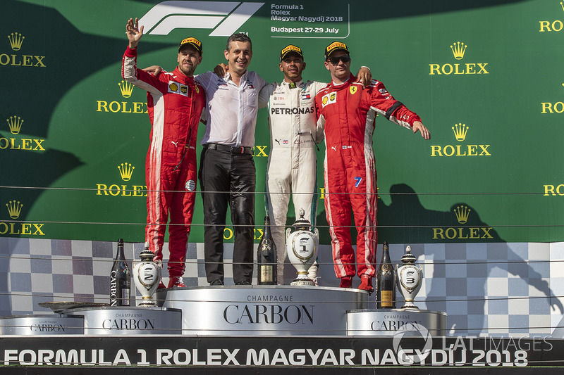 Sebastian Vettel, Ferrari, Lewis Hamilton, Mercedes-AMG F1 and Kimi Raikkonen, Ferrari celebrate on the podium