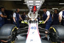 Robert Kubica, Williams Martini Racing, lwers himself into his seat