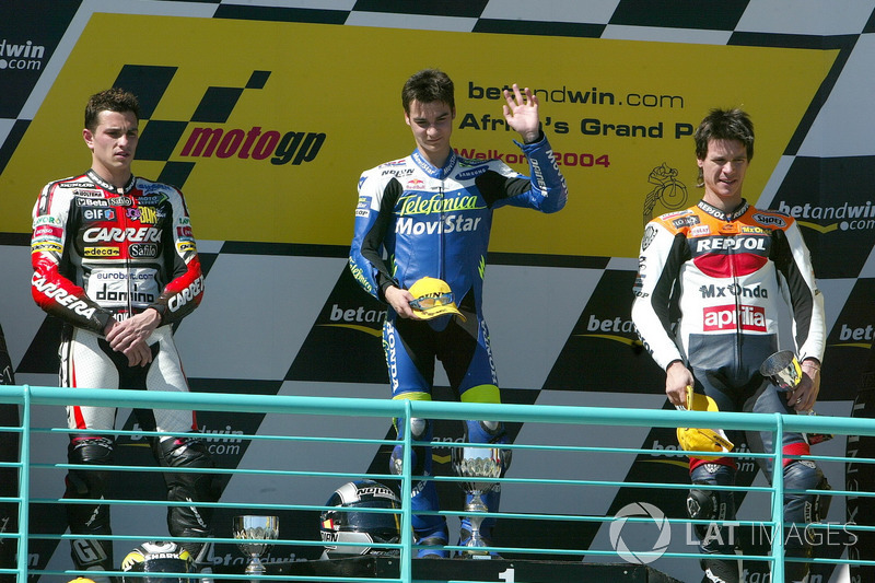 Podium: second place Randy De Puniet, Race winner Dani Pedrosa, third place Sebastián Porto