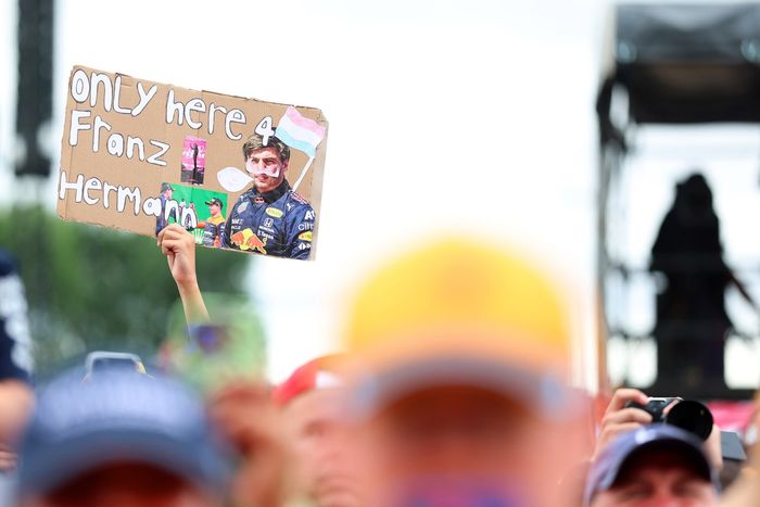 A fan of Max Verstappen, Red Bull Racing holds up a sign