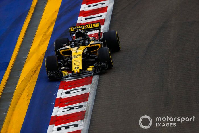 Nico Hulkenberg, Renault Sport F1 Team R.S. 18, runs wide over a kerb and strikes up sparks