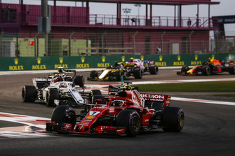 Kimi Raikkonen, Ferrari SF71H, leads Charles Leclerc, Sauber C37, Romain Grosjean, Haas F1 Team VF-18, and Nico Hulkenberg, Renault Sport F1 Team R.S. 18, and the remainder of the field at the start