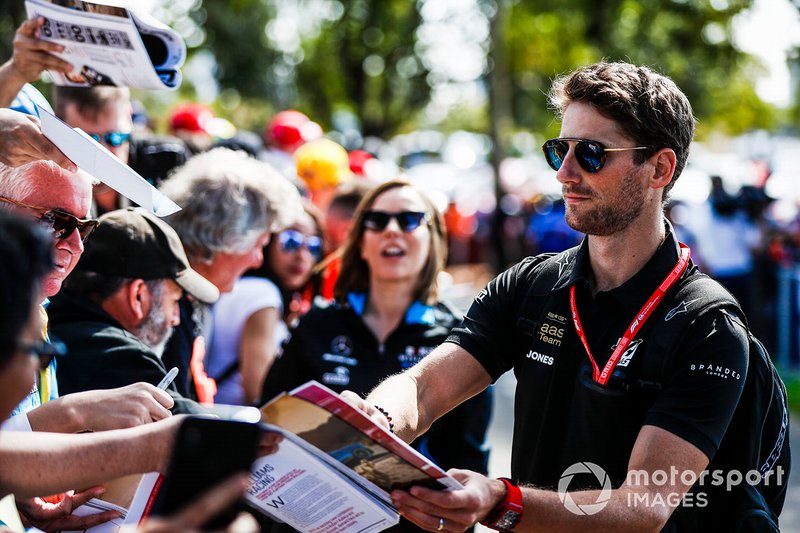 Romain Grosjean, Haas F1 Team signs an autograph for a fan