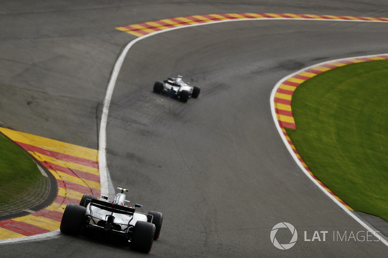 Lance Stroll, Williams FW40, follows Felipe Massa, Williams FW40, through Eau Rouge