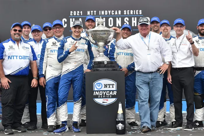 Champion Alex Palou, team owner Chip Ganassi and Chip Ganassi Racing team