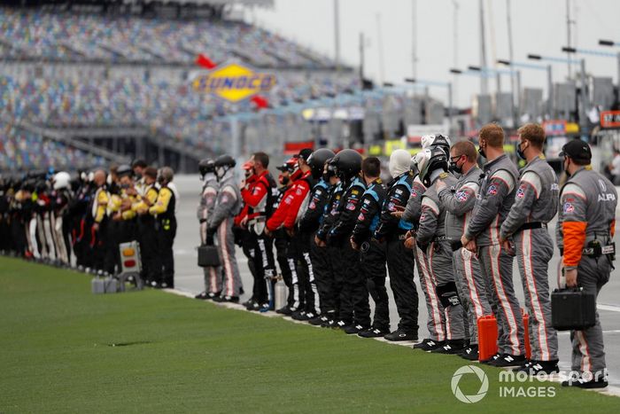 The teams  salute the field  