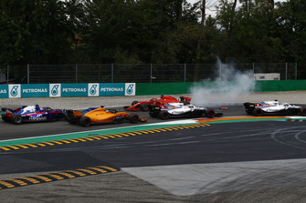 Sebastian Vettel, Ferrari SF71H facing the wrong way after making contact with Lewis Hamilton, Mercedes AMG F1 W09 while Lance Stroll, Williams FW41, Sergey Sirotkin, Williams FW41, Fernando Alonso, McLaren MCL33 and Pierre Gasly, Scuderia Toro Rosso STR13