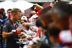 Kevin Magnussen, Haas F1 Team, signs autographs for fans