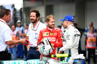 Sebastian Vettel, Ferrari and Valtteri Bottas, Mercedes AMG F1 in Parc Ferme