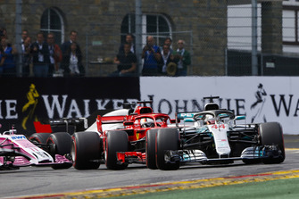 Lewis Hamilton, Mercedes AMG F1 W09, leads Sebastian Vettel, Ferrari SF71H, and Sergio Perez, Racing Point Force India VJM11