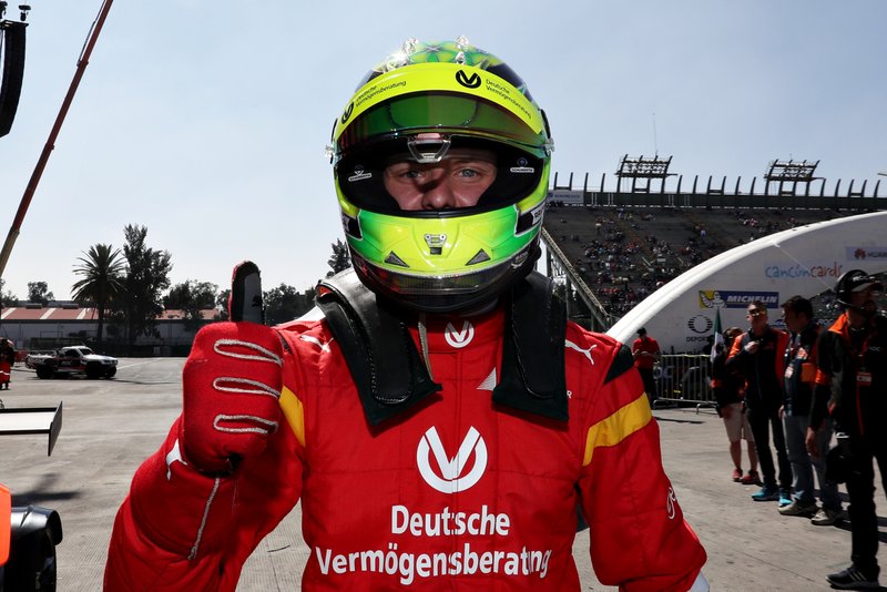 Mick Schumacher celebrates winning in the qualifying round