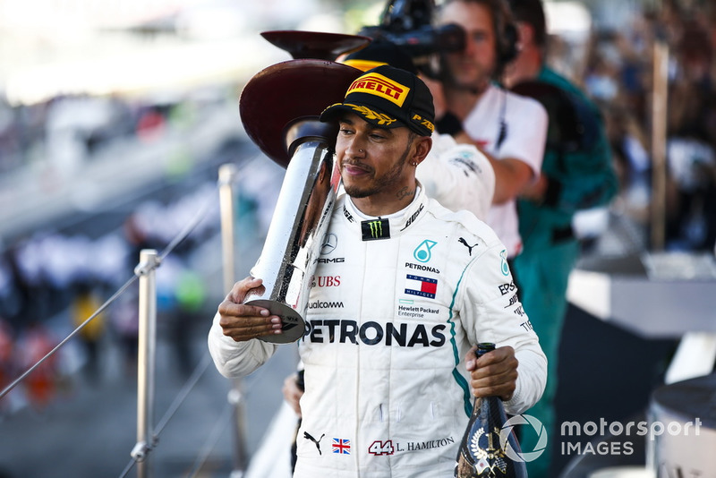 Race winner Lewis Hamilton, Mercedes AMG F1, leaves the podium with his trophy