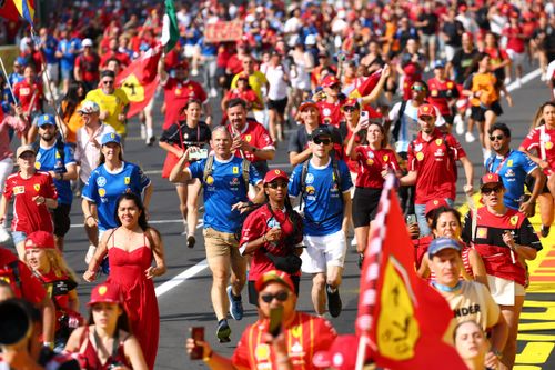 Fans flood the track after the race.