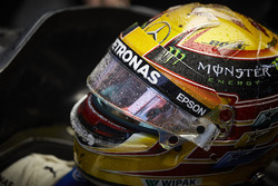 Lewis Hamilton, Mercedes AMG F1, sits in the cockpit of his car in the garage