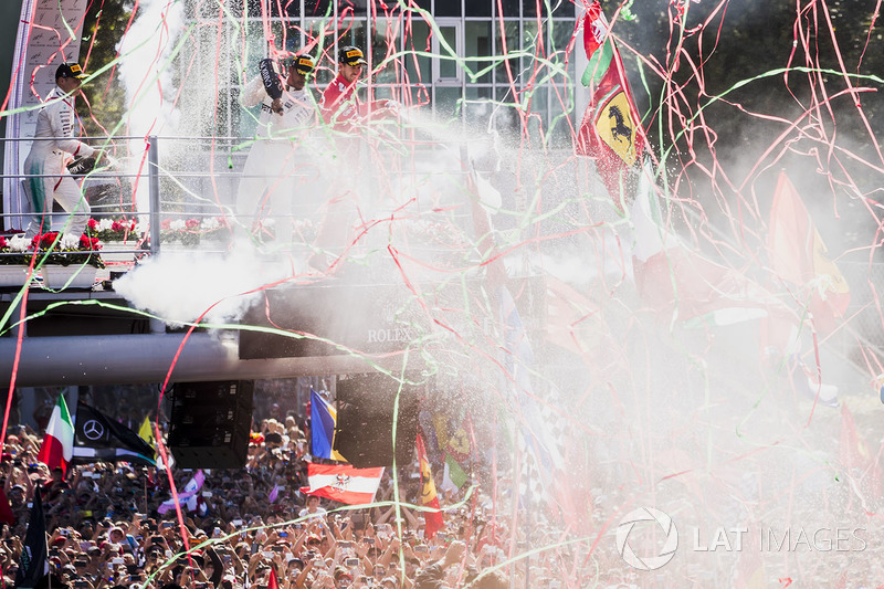 Second place Valtteri Bottas, Mercedes AMG F1, Race winner Third place Lewis Hamilton, Mercedes AMG F1 Sebastian Vettel, Ferrari, celebrate on the podium, Champagne