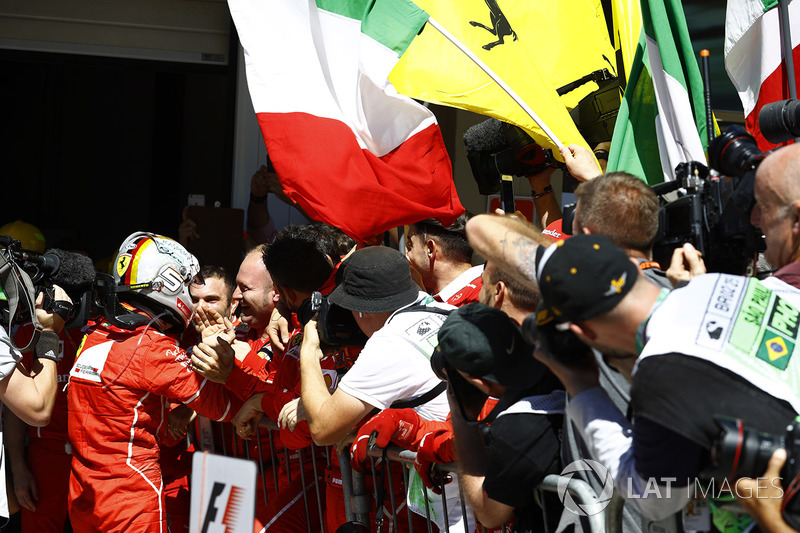 Sebastian Vettel, Ferrari SF70H, celebrates with his team after winning the race