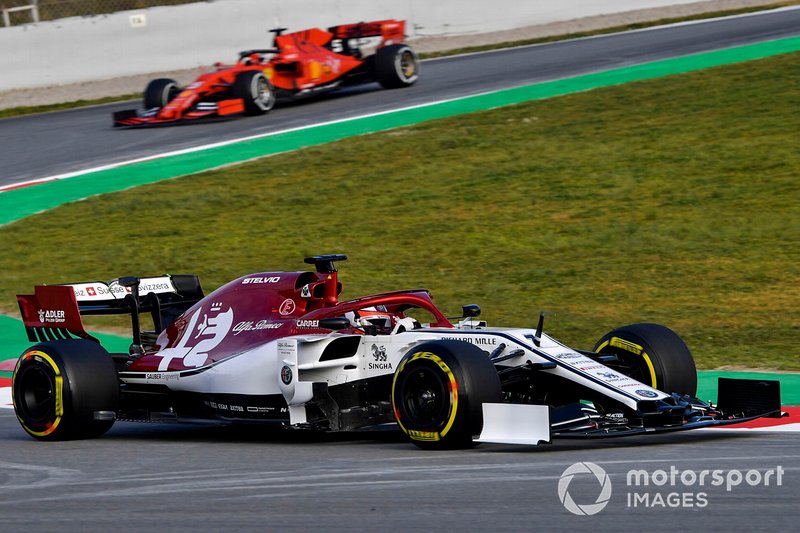 Kimi Raikkonen, Alfa Romeo Racing C38, leads Sebastian Vettel, Ferrari SF90