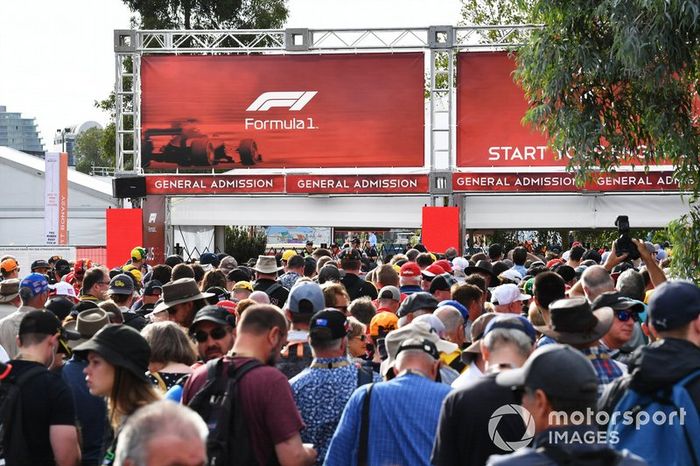 Fans queue at the delayed opening gates