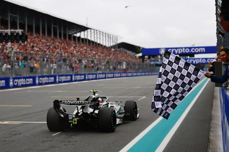 Rafael Nadal waves the chequered flag for Race winner Andrea Kimi Antonelli, Mercedes