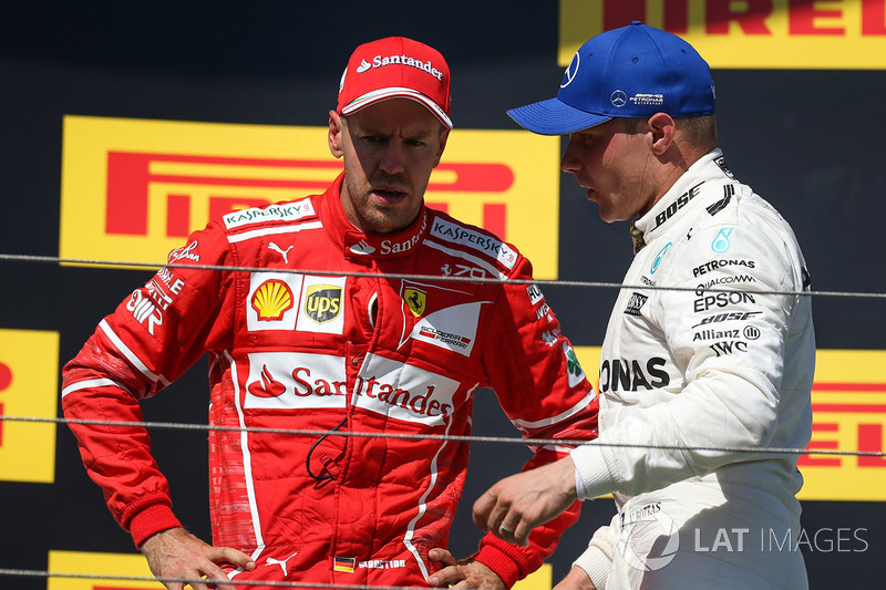 Podium: race winner Sebastian Vettel, Ferrari, third place Valtteri Bottas, Mercedes AMG F1