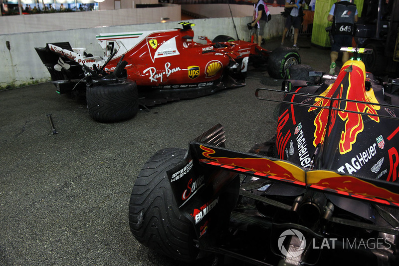 The damaged cars of Kimi Raikkonen, Ferrari SF70H and Max Verstappen, Red Bull Racing RB13 after col