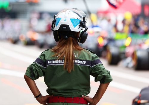 A marshal looks down the pit lane 