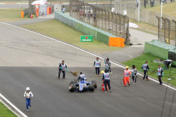 Marshals clear the wreckage of Antonio Giovinazzi, Sauber C36
