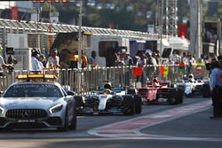 The safety car lines-up in the pit lane ahead of Lewis Hamilton, Mercedes AMG F1 W08