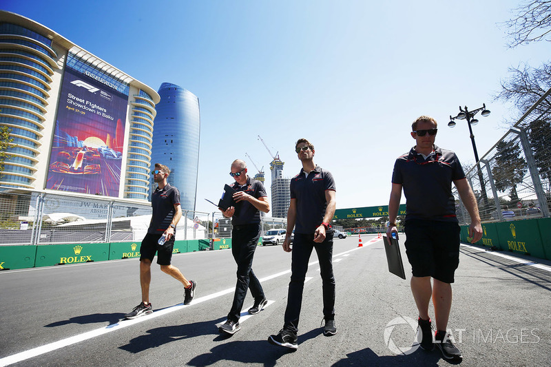 Romain Grosjean, Haas F1 Team VF-18 Ferrari, walks the circuit with his team