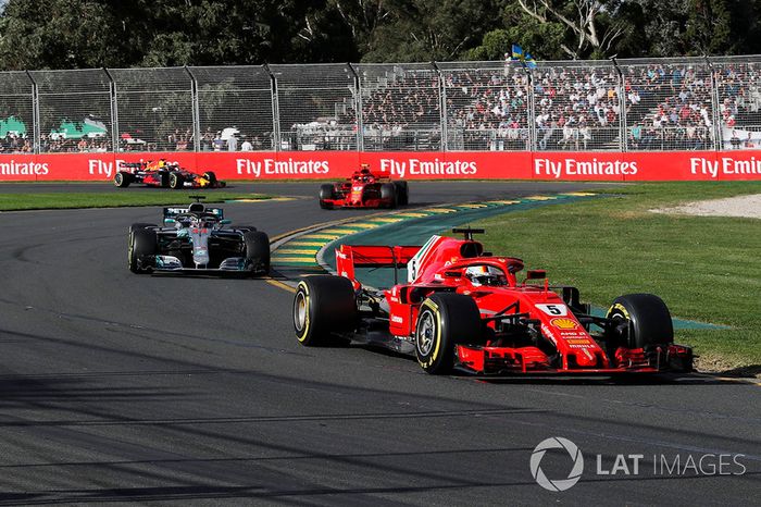 Sebastian Vettel, Ferrari SF71H leads Lewis Hamilton, Mercedes-AMG F1 W09 