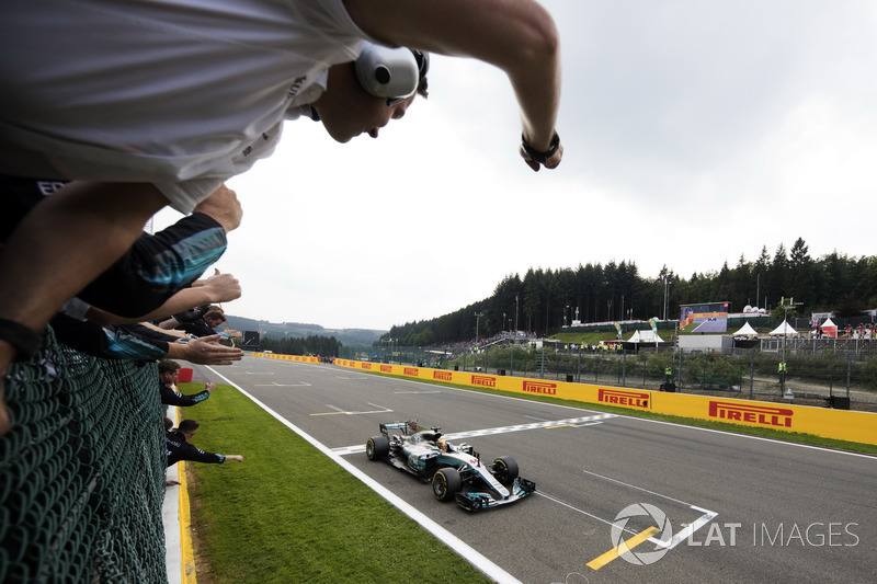 Lewis Hamilton, Mercedes AMG F1 W08, race winner, takes the chequered flag for victory
