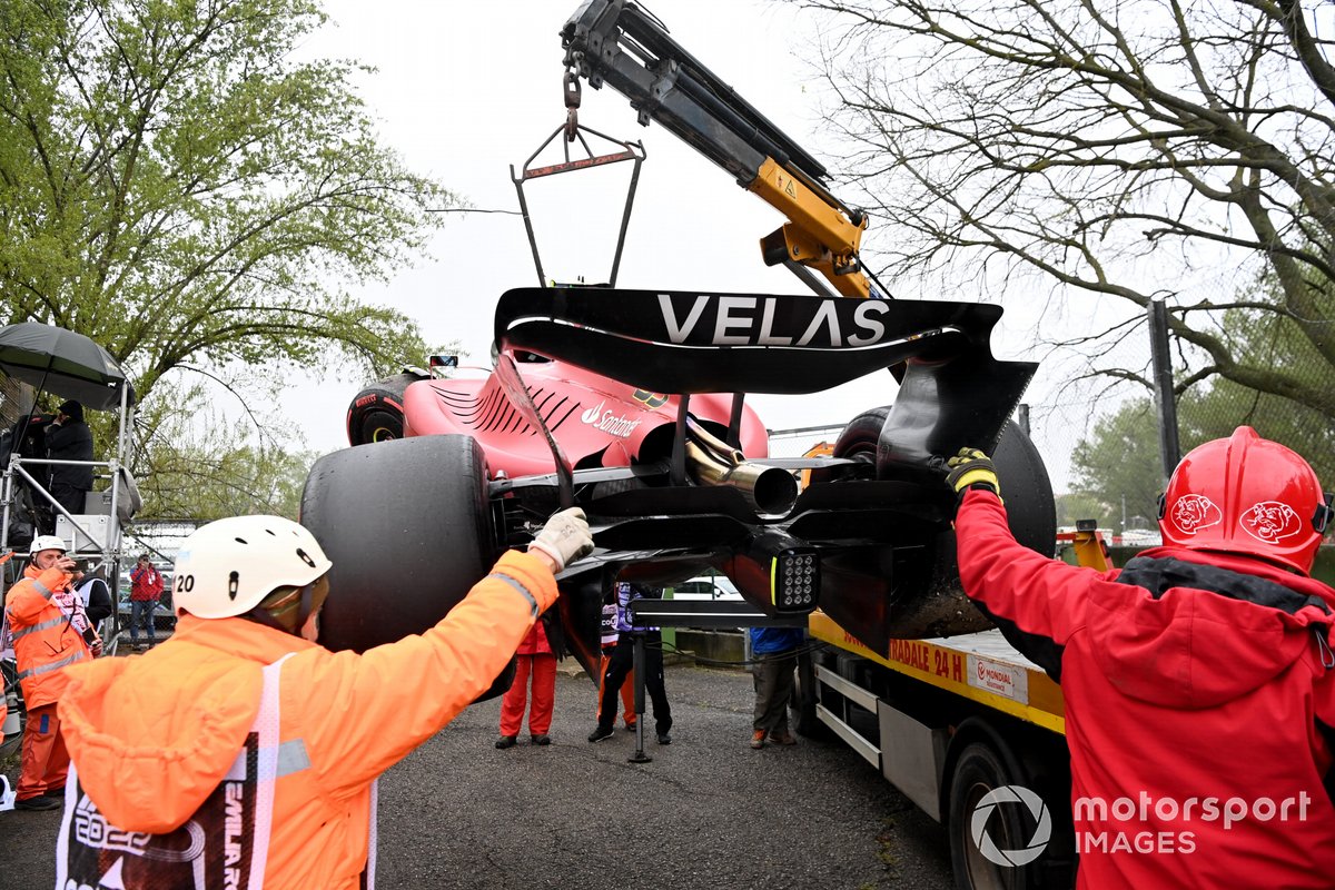 Marshals load the car of Carlos Sainz Jr., Ferrari F1-75, onto a truck