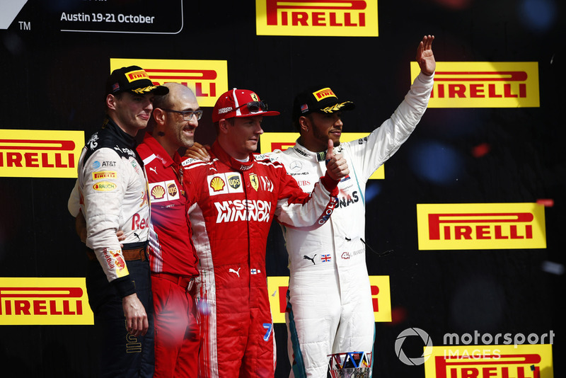Kimi Raikkonen, Ferrari, celebrates on the podium after winning the race with Max Verstappen, Red Bull Racing, Carlos Santi, Race Engineer, Ferrari, and Lewis Hamilton, Mercedes AMG F1