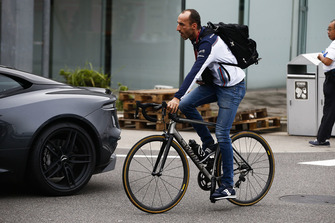 Robert Kubica, Williams Racing, arrives in the paddock on a bike