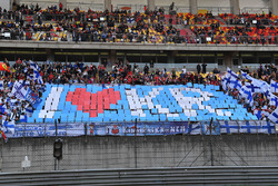Kimi Raikkonen, Ferrari fans and banner