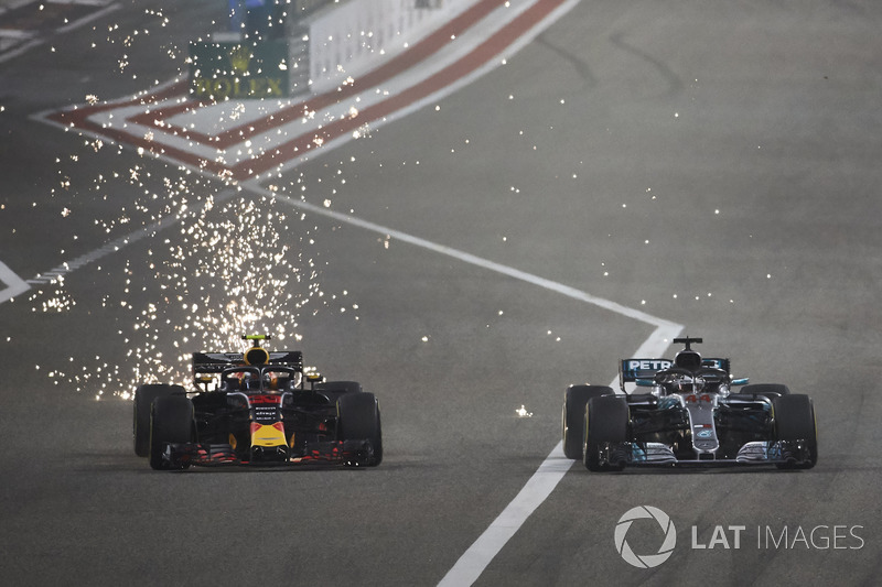 Sparks fly as Max Verstappen, Red Bull Racing RB14 Tag Heuer, battles with Lewis Hamilton, Mercedes AMG F1 W09