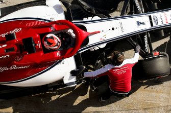 Kimi Raikkonen, Alfa Romeo Racing, stops in his pit area