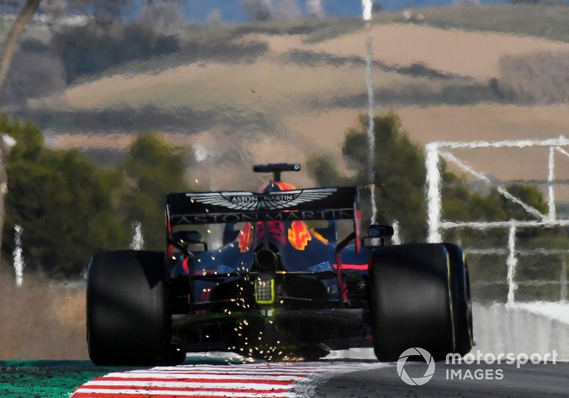 Max Verstappen, Red Bull Racing RB15, strikes sparks on a kerb