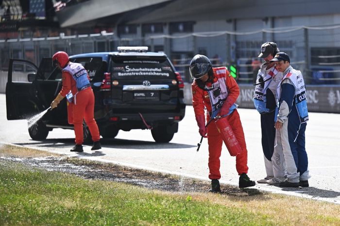 Marshals extinguish a trackside fire in Q2 during qualifying 