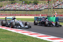 Lewis Hamilton, Mercedes AMG F1, W07 Hybrid; Jenson Button, McLaren-Honda, MP4-31