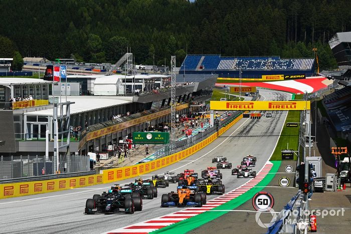 Lewis Hamilton, Mercedes F1 W11 EQ Performance, leads Max Verstappen, Red Bull Racing RB16, Carlos Sainz Jr., McLaren MCL35 Valtteri Bottas, Mercedes F1 W11 EQ Performance and the rest of the pack at the start