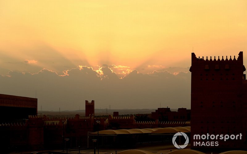 The sun sets over the track