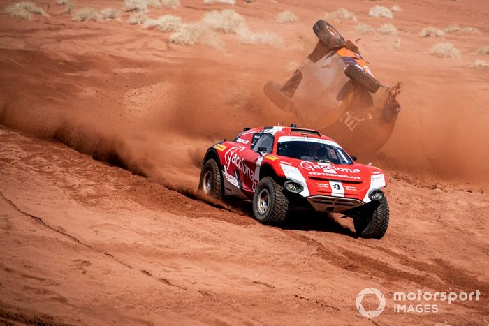 Laia Sanz, Carlos Sainz, Sainz XE Team, as Catie Munnings, Timmy Hansen, Andretti United Extreme E, begins to roll