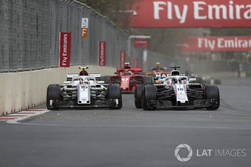 Charles Leclerc, Sauber C37 and Lance Stroll, Williams FW41 battle